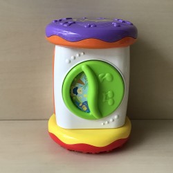 Speelrol met muziek. Hoogte 20 cm. Diameter 14 cm.