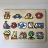 Puzzelplankje Knopjespuzzel : 14 stukjes.
