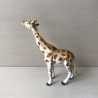 Giraffe.  16 cm. lang en 16 cm. hoog.