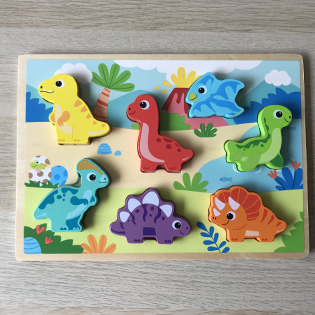 Puzzelplankje Knopjespuzzel. Met 7 Dinosaurus figuren.