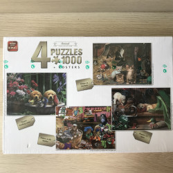 Doos met 4 puzzels van poezen en honden. Nieuw