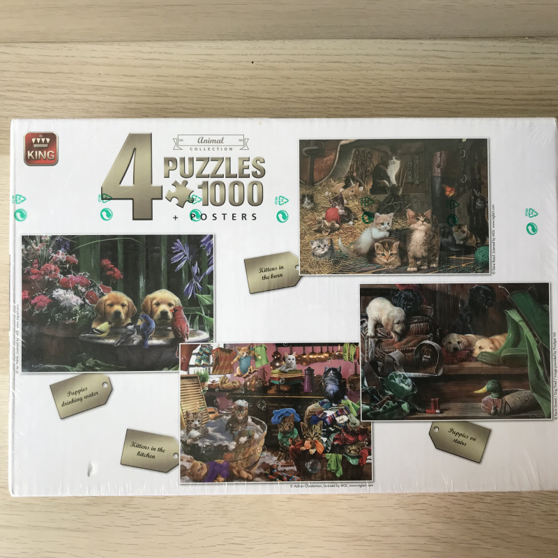 Doos met 4 puzzels van poezen en honden. Nieuw