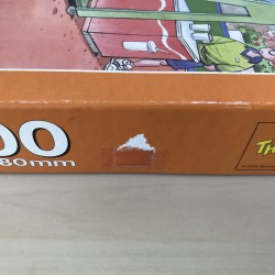 The Champion : puzzel 1000 stukjes. Deksel heeft beschadigingen.
